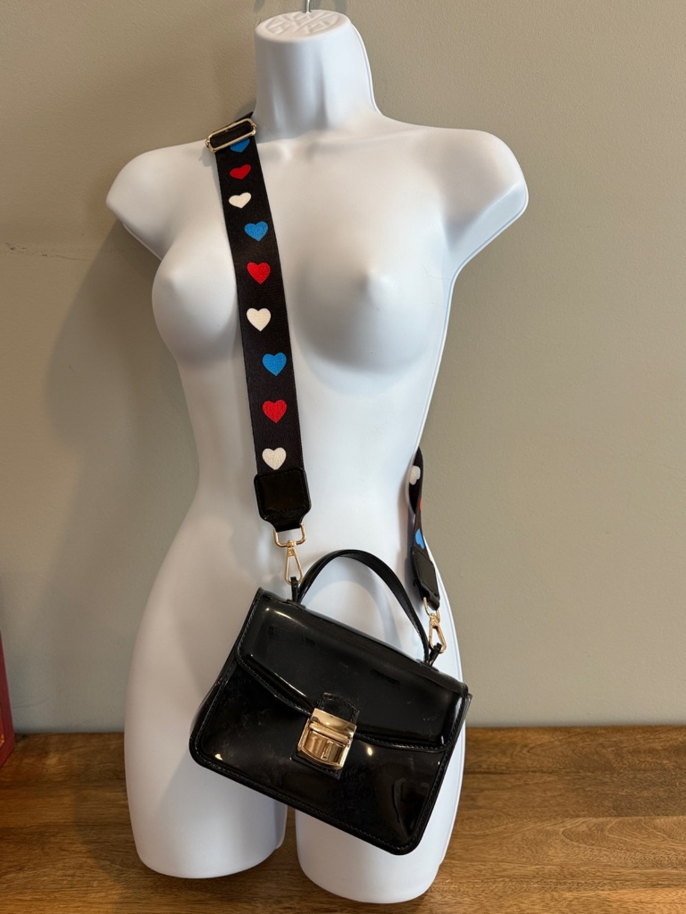 Black Patent Top-Handle Crossbody Bag with Heart-Print Strap